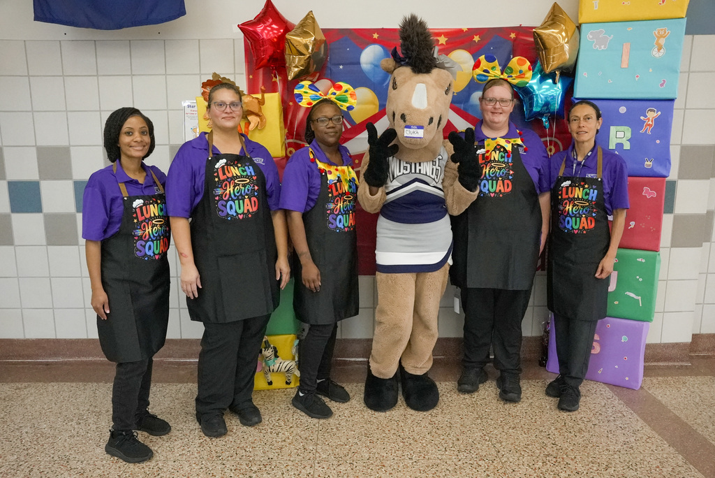 WOSHS Mascot Clutch and WOSMS cafeteria staff