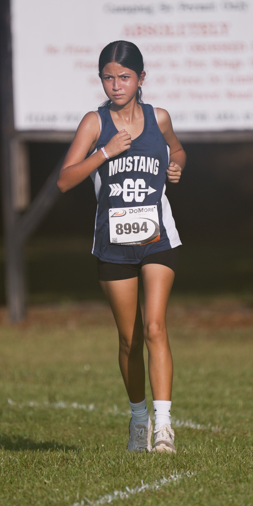 WOS girl running at cross country meet