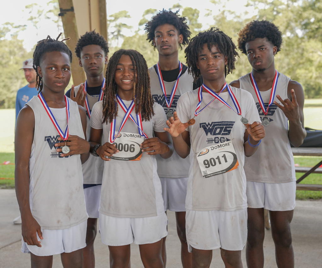 JV boys team holding up their medals