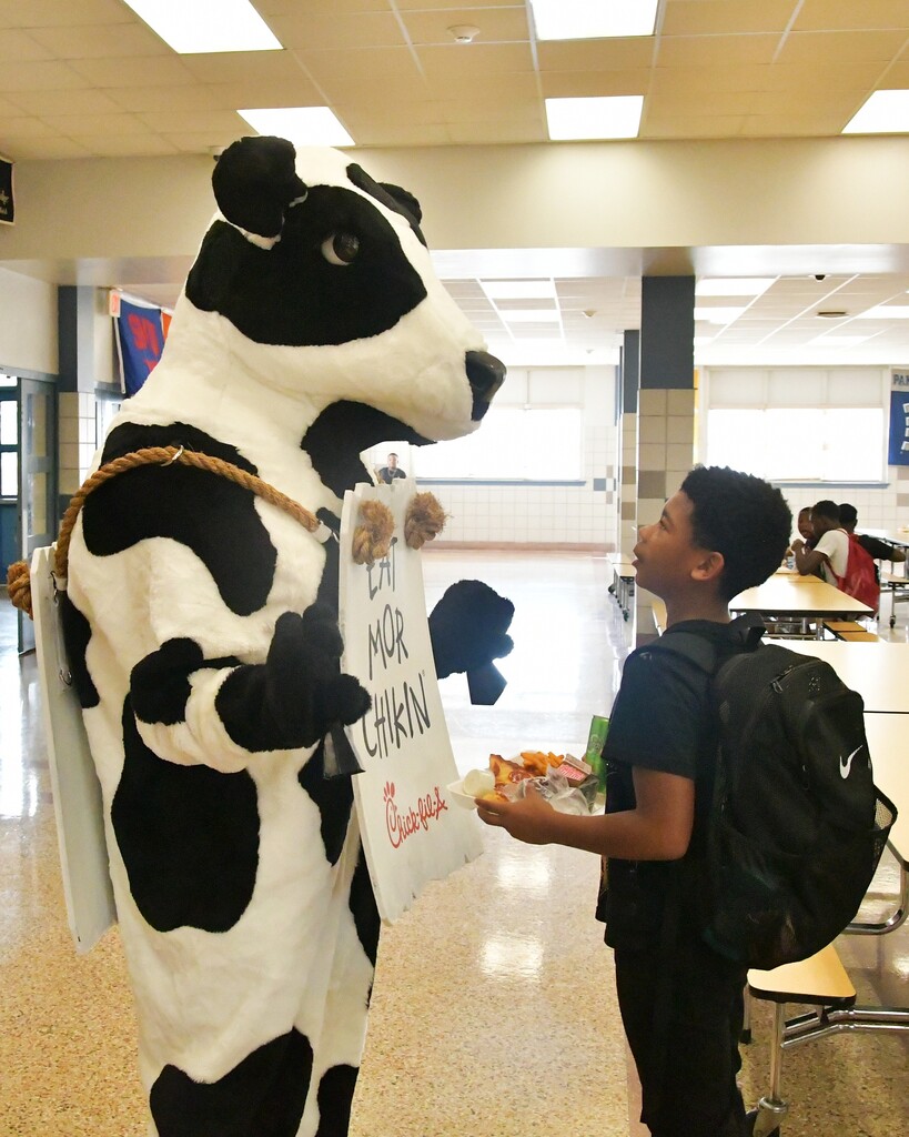 WOSMS student talking with Cow mascot