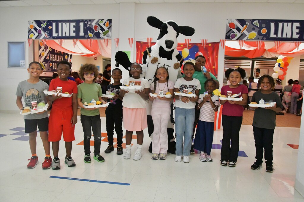 Happy WOSE students with Cow the Chick-Fil-A Mascot
