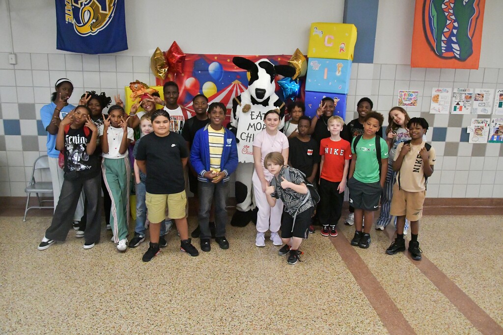 Happy WOSMS students with Cow the Chick-Fil-A Mascot