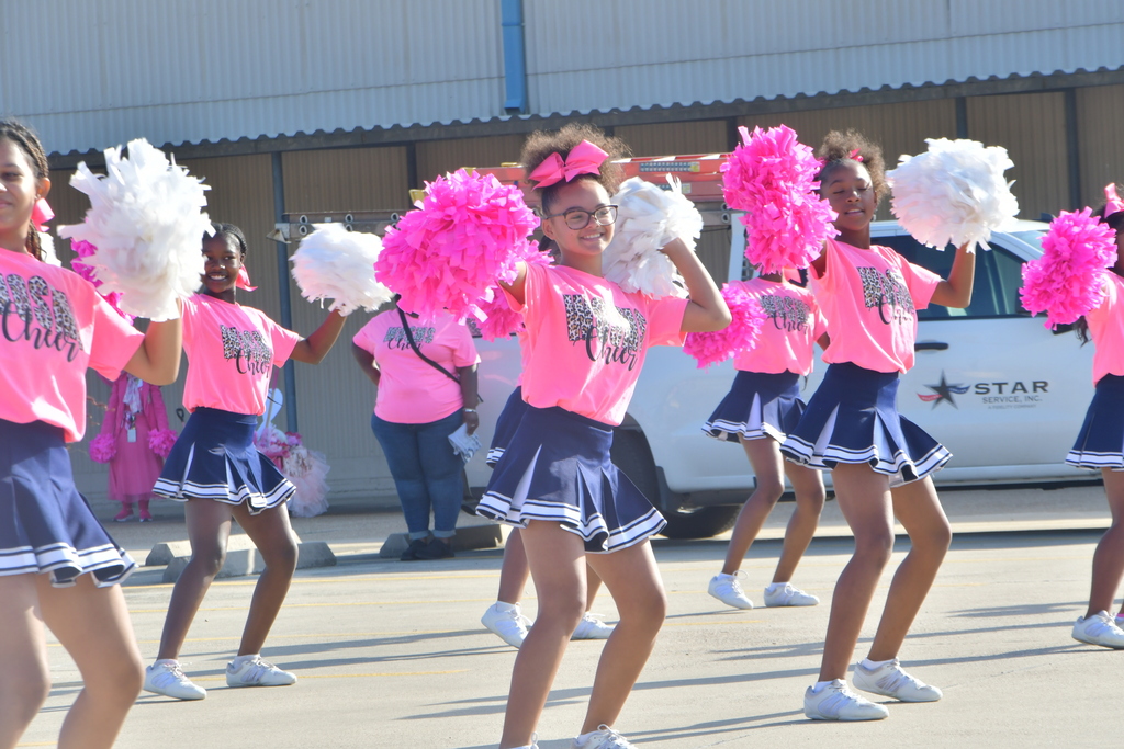 cheerleaders wearing pink t-shirts