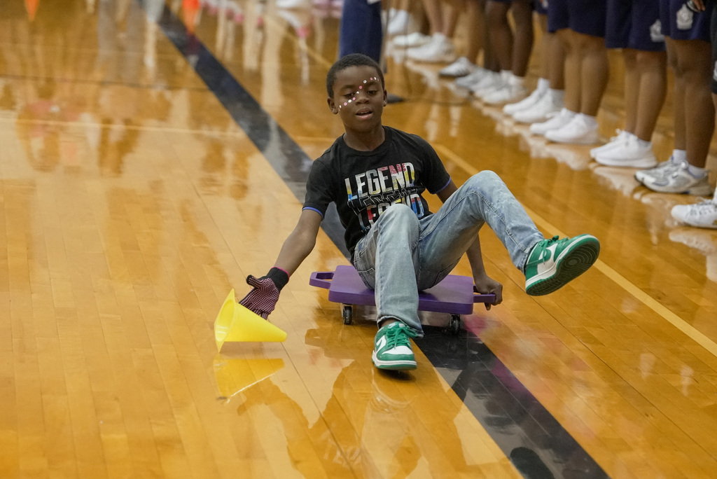 kid sliding on a slider in a race