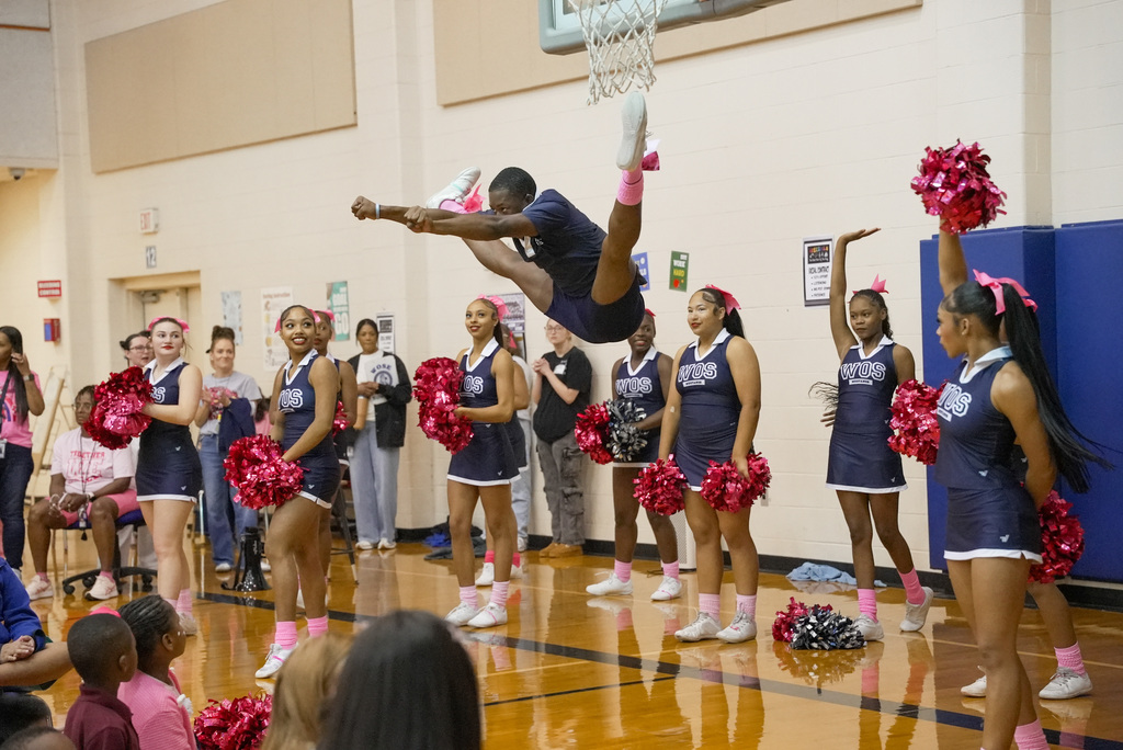 cheer captain doing a high toe point