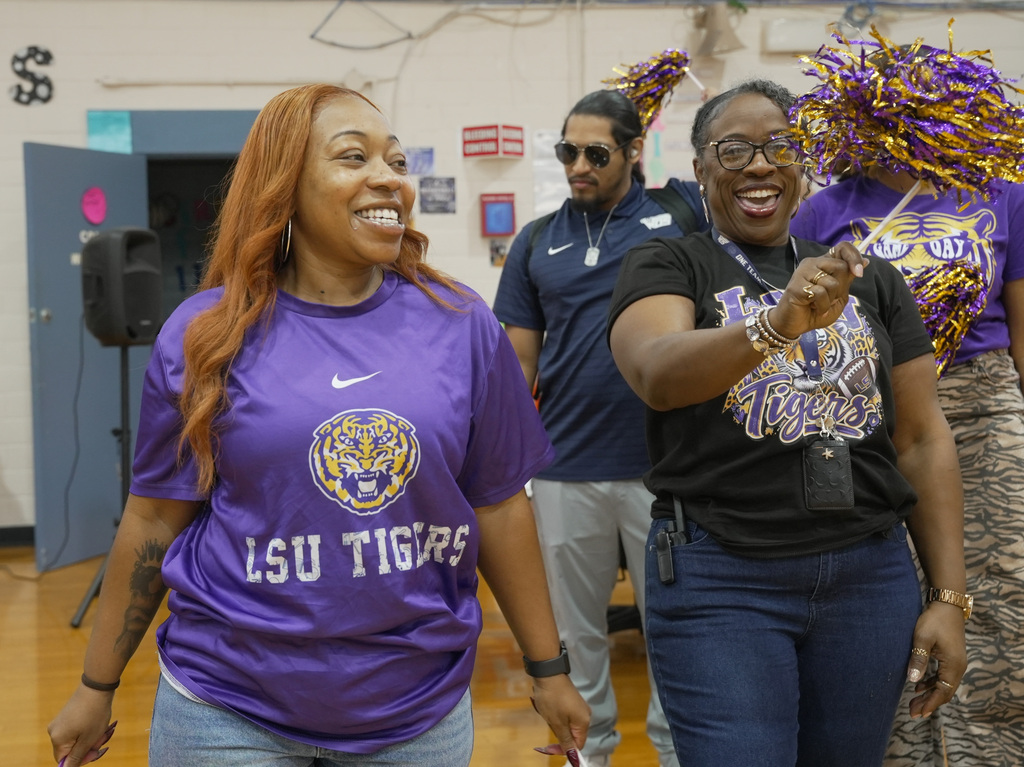 teachers smiling in LSU gear