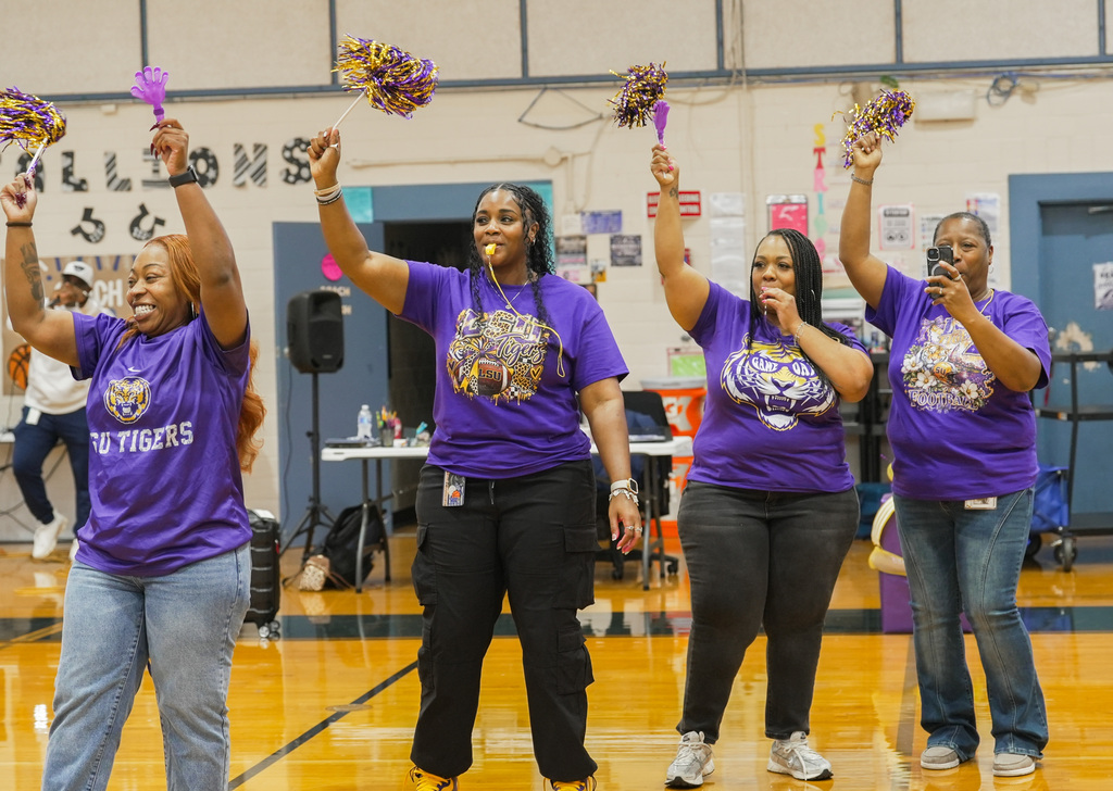 teacher with pompoms and whistles cheer