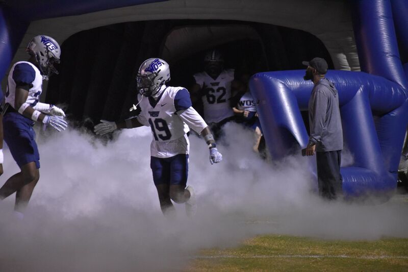 Players shaking hand during the pre game run out