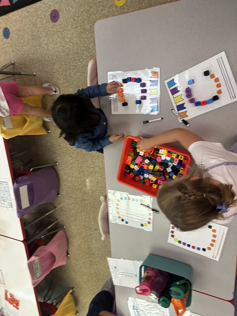 Students sorting colored shapes