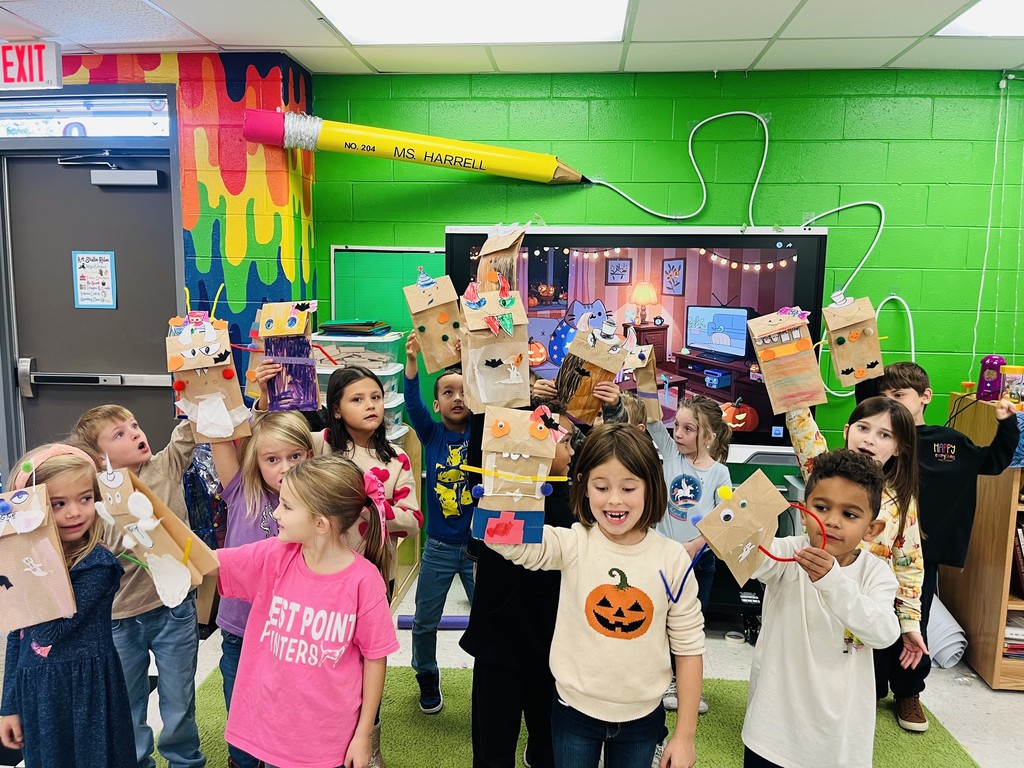 Students with their puppets