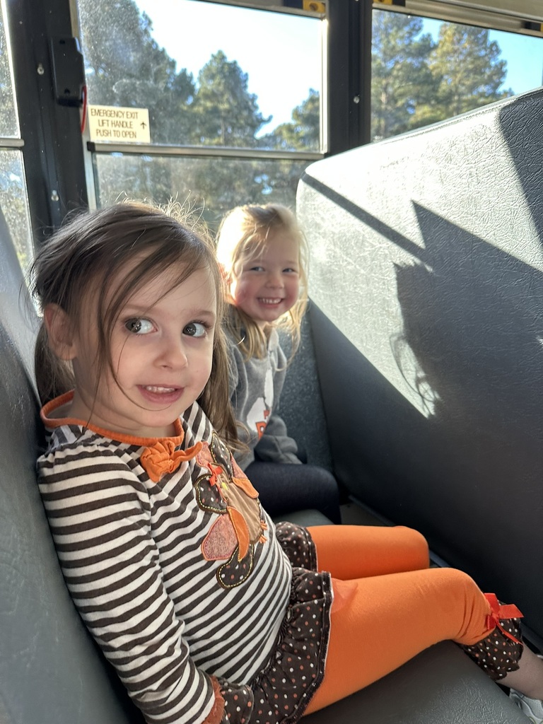 2 students on the bus to the pumpkin patch