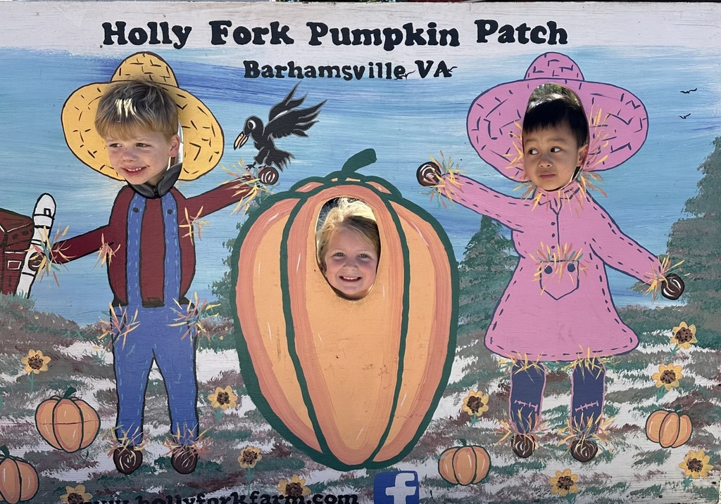 Students in costume board at pumpkin patch