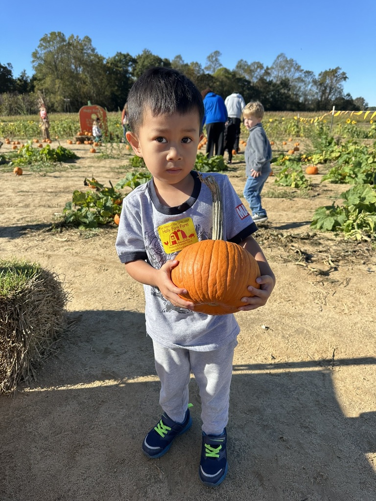 student with his pumpkin
