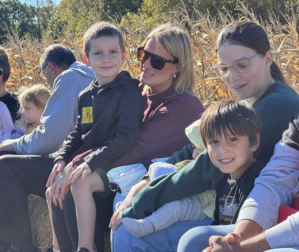 Parents and their students on the hayride