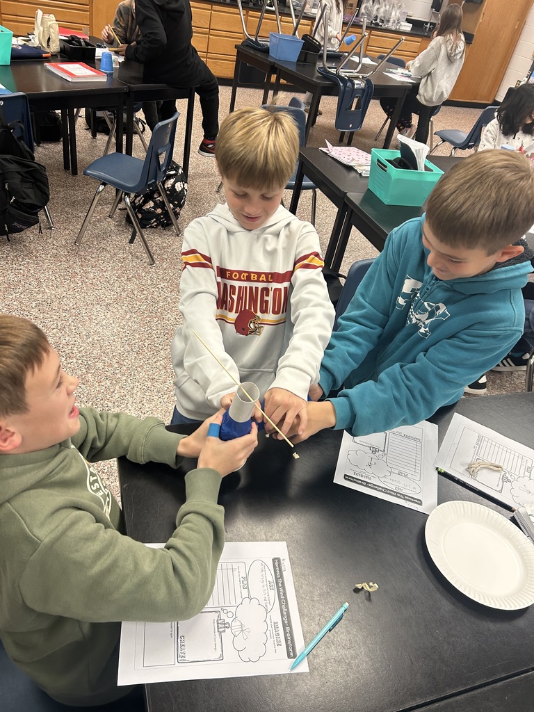3 students working on their windmill