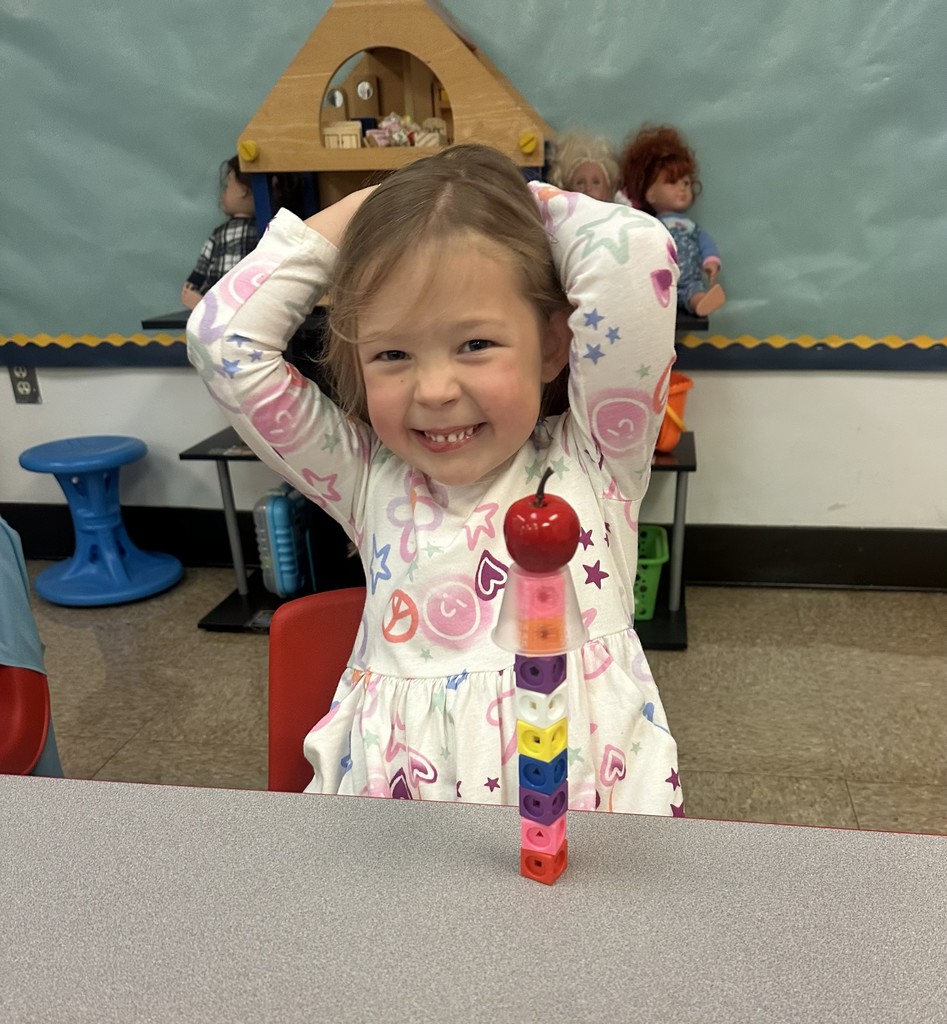 Student building an apple stack