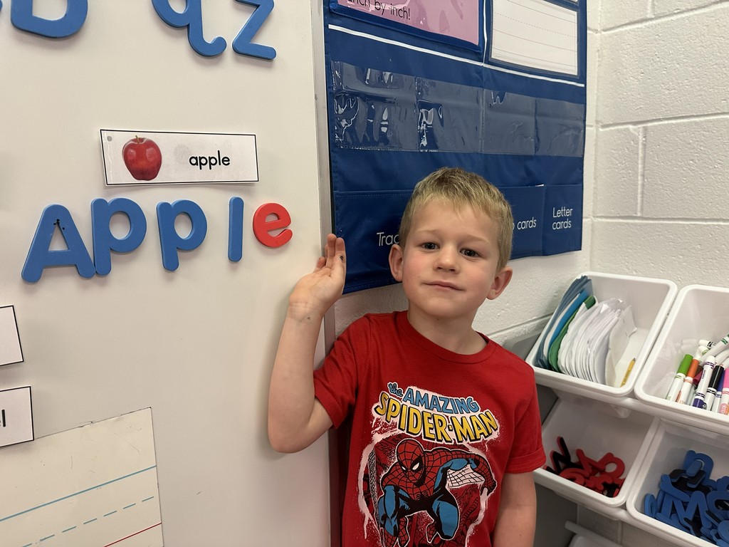 Student with the word apple