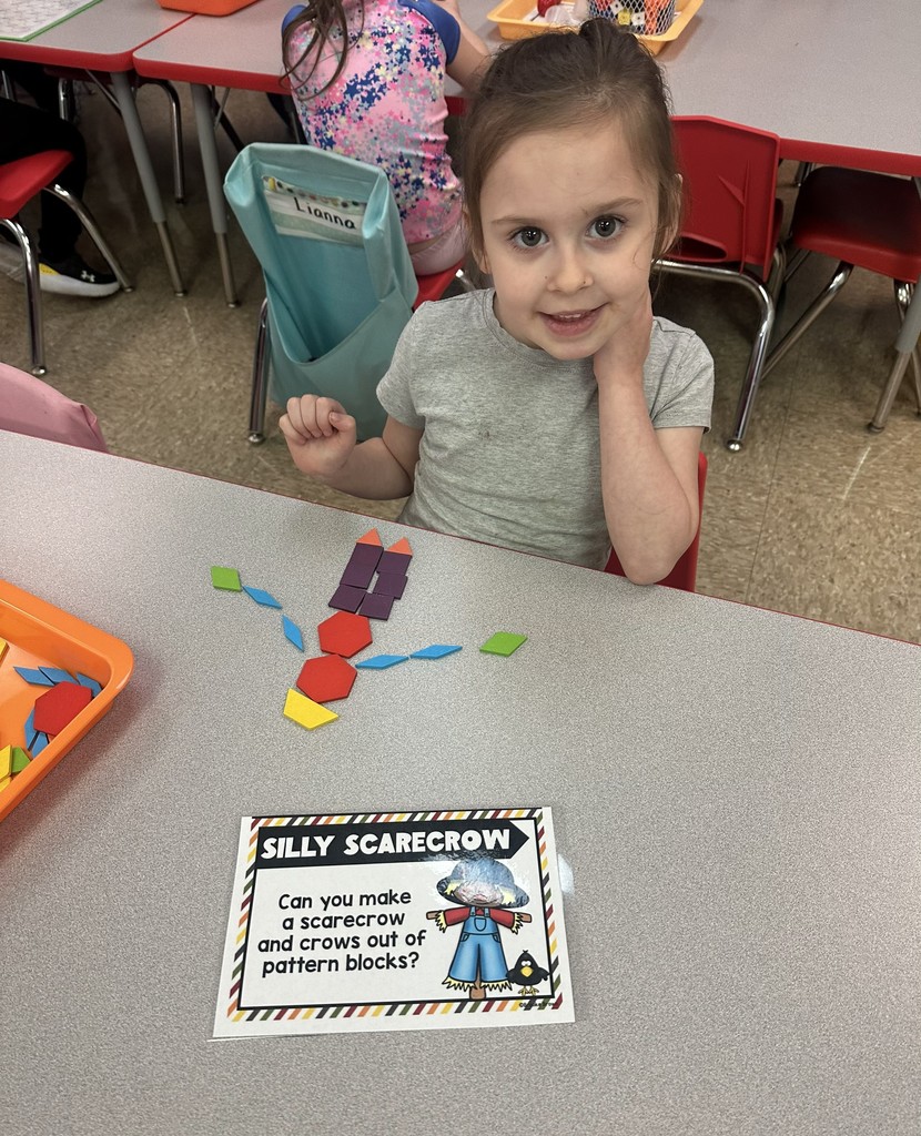 Student building a silly scarecrow