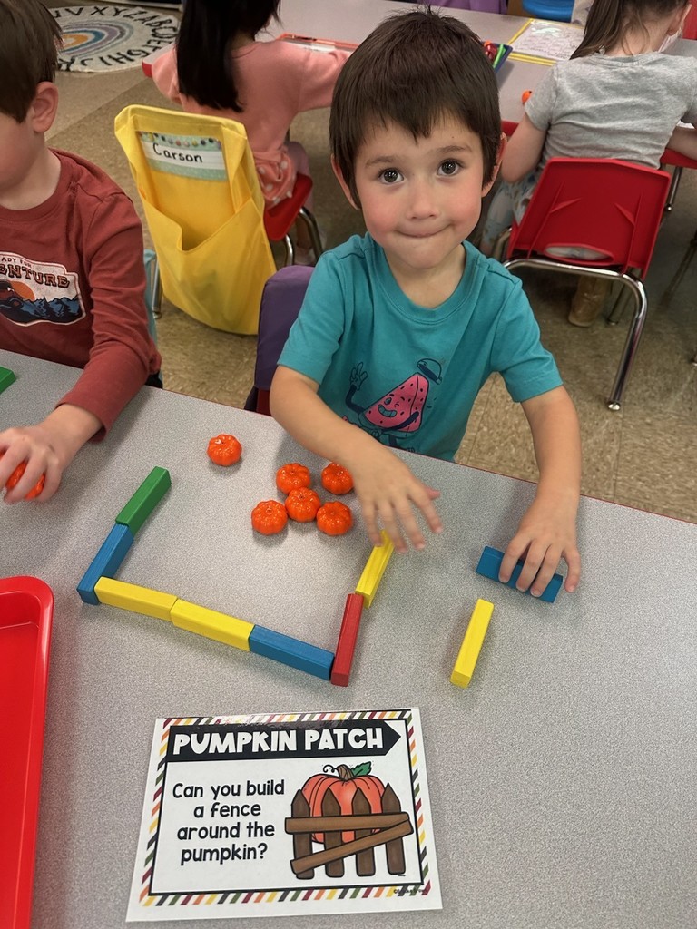 Student building a pumpkin patch