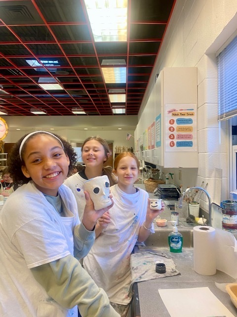 Students with their art