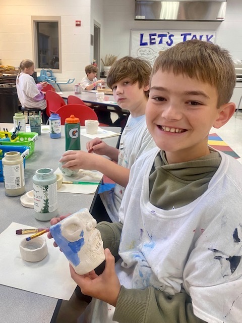 Students with their art