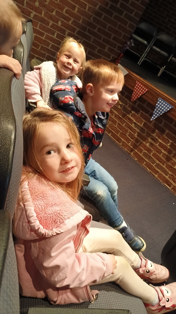 PreK enjoying a performance in the auditorium