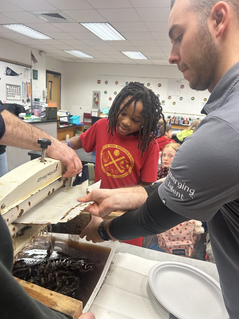 Student working with WestRock staff making paper