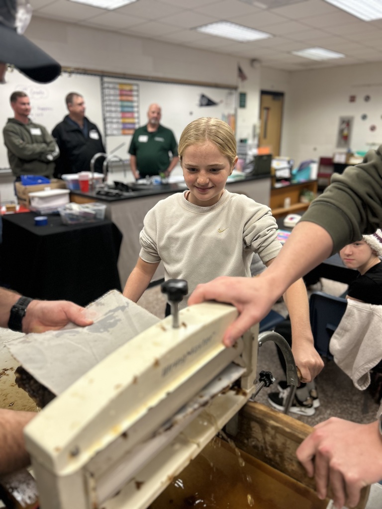 Student working with WestRock staff making paper