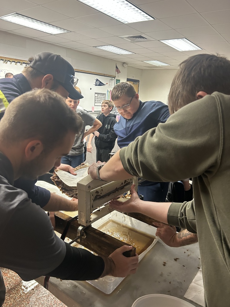 Students working with WestRock staff making paper