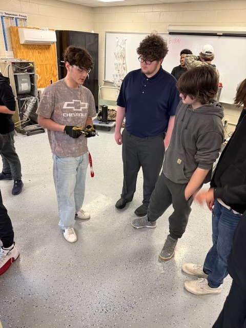 students discussing tools