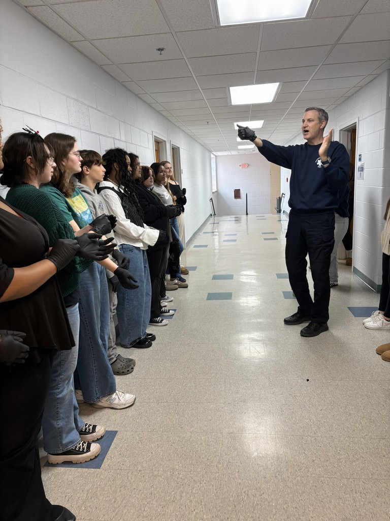 students listening to an instructor
