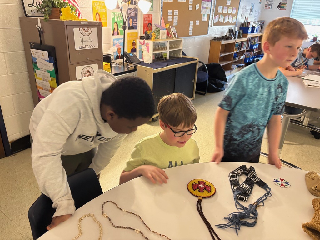 Students looking at artifacts