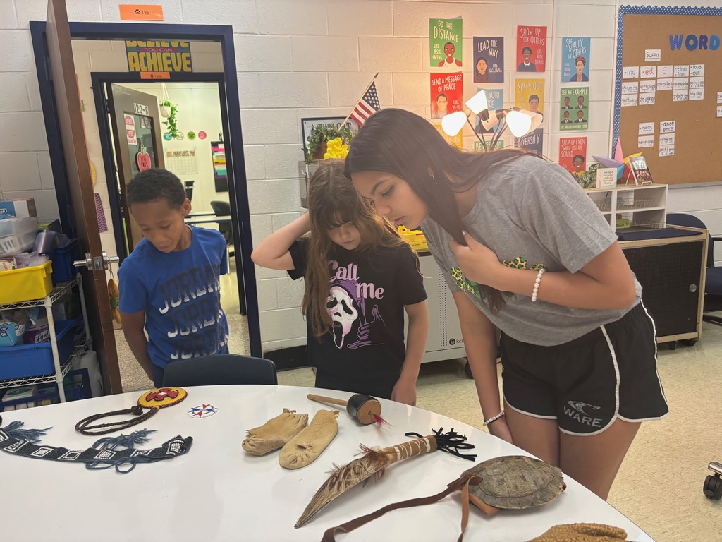 Students looking at artifacts