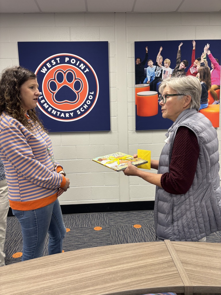 Gift of a book to WPES Librarian