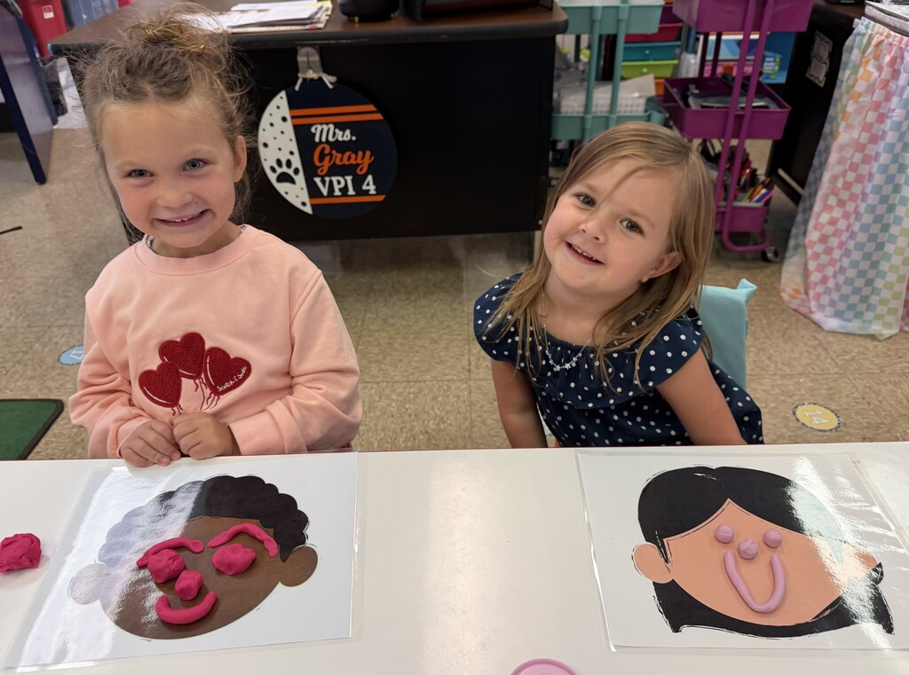 students with playdough faces