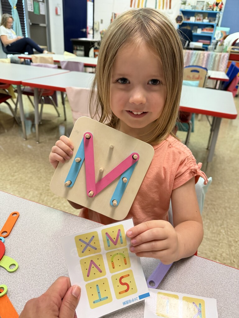 Student with the letter M