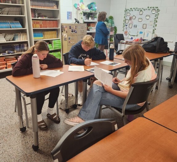 Students from Ms. Ambrose’s English 12 DE classes participating in a college admission simulation