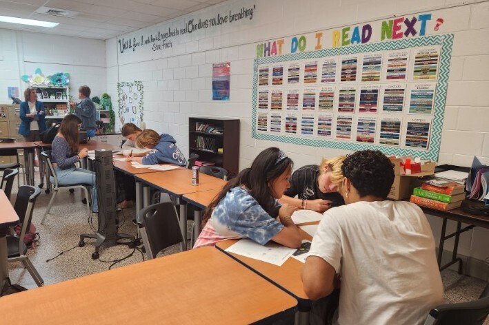 Students from Ms. Ambrose’s English 12 DE classes participating in a college admission simulation