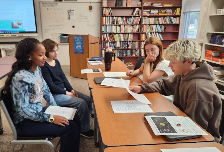 Students from Ms. Ambrose’s English 12 DE classes participating in a college admission simulation