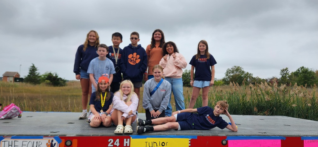 West Point Public Schools BETA students proudly represent WPPS at the Crab Carnival, showing their Pointer Pride and community spirit. Eleven students on a crab carnival float sitting standing and lounging