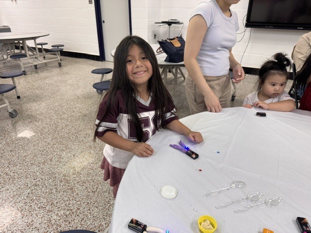 ELL students and their families enjoy a welcome-back cookout while students participate in five hands-on science activities hosted by the ELL Family Engagement Committee.