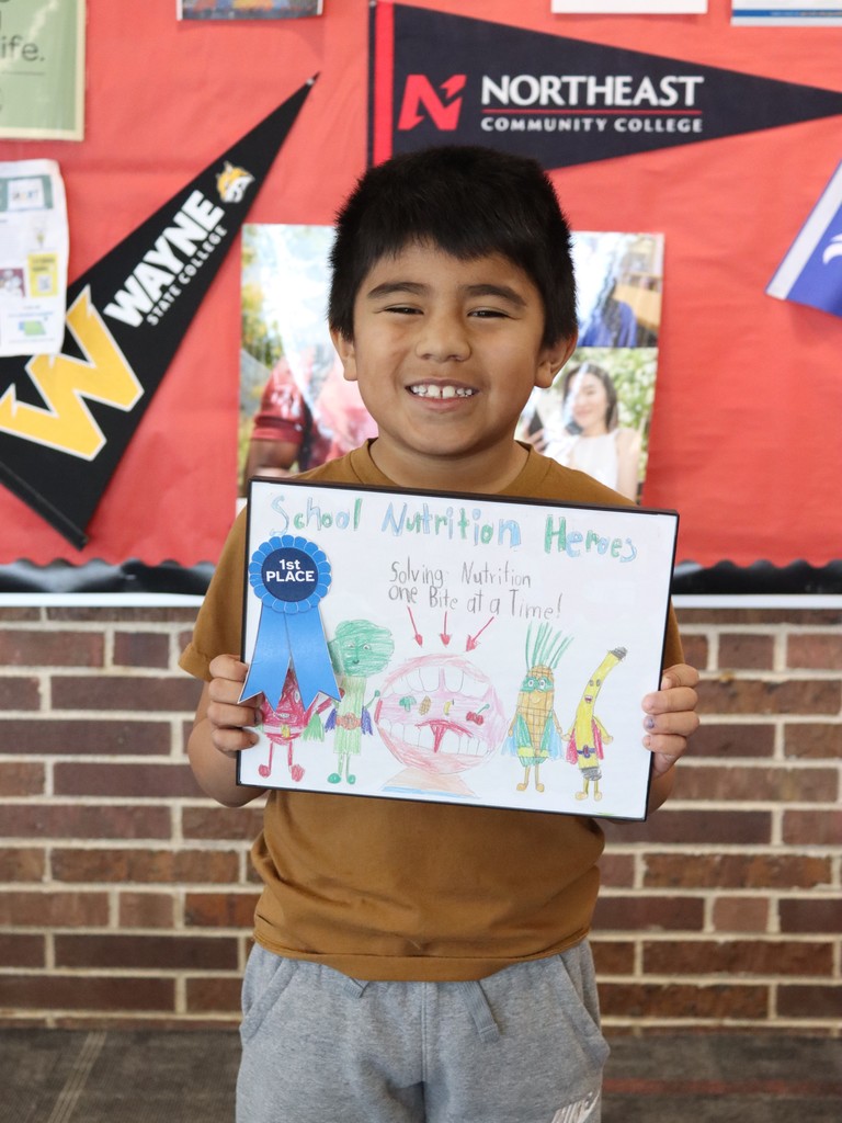 Miguel Perez, West Point Elementary 2nd grader, was selected as a winner in the 2026 Nebraska School Nutrition Association Art Contest!   The drawing incorporated the theme “School Nutrition Heroes- Solving Nutrition, One Bite at a Time”.   He and his family are invited to attend the Nebraska School Nutrition Association Conference this summer where he will be recognized, and he will also receive $50 and a night in the Holiday Inn in Kearney.   Congratulations, Miguel!   #cadetpride⚔️