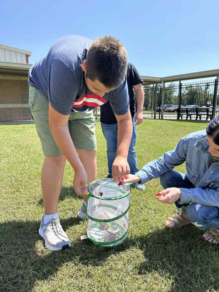Vance and Ms. Heather releasing the butterflies