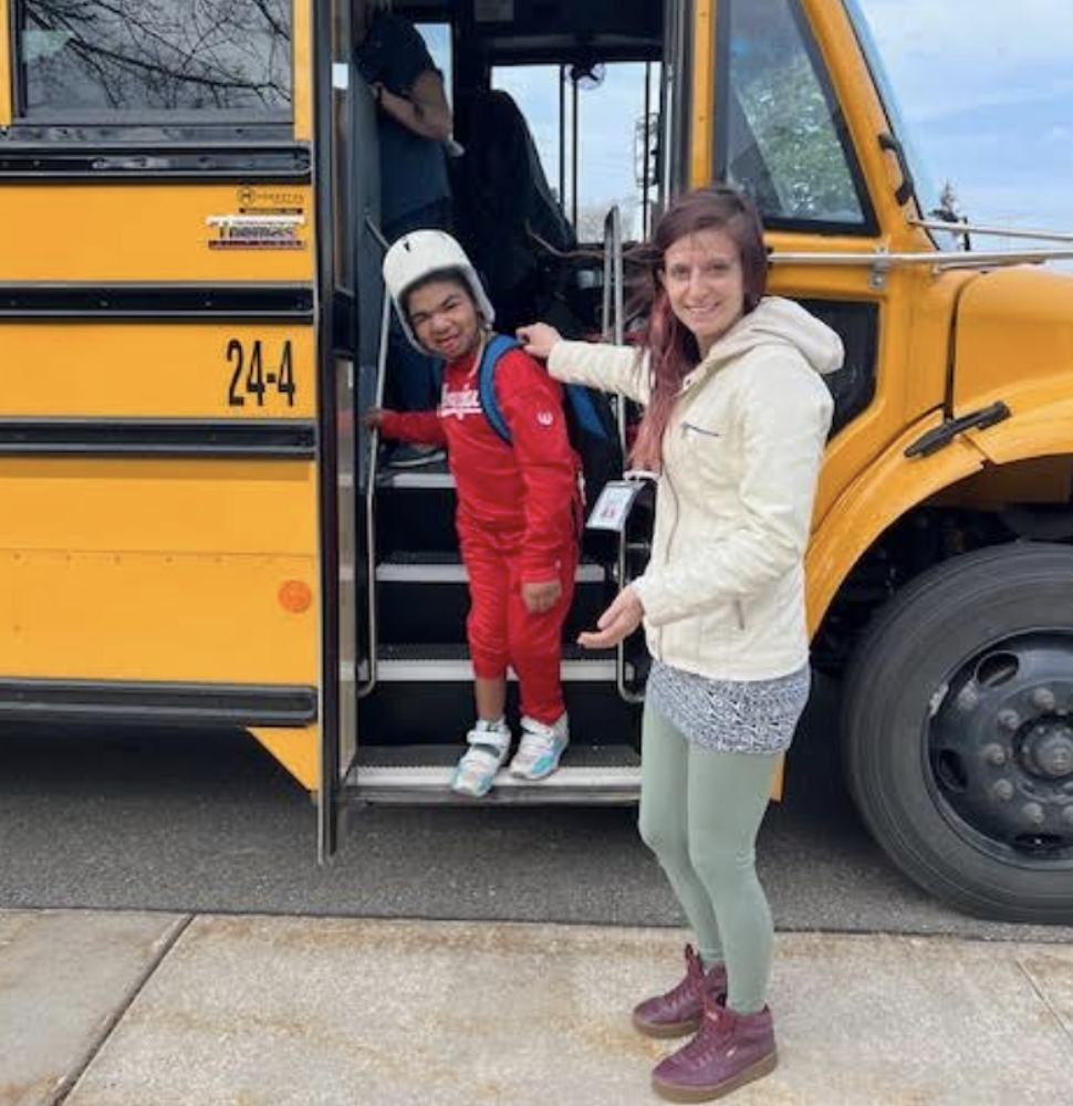 Student getting off a bus