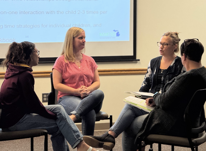 Teacher meeting in a group