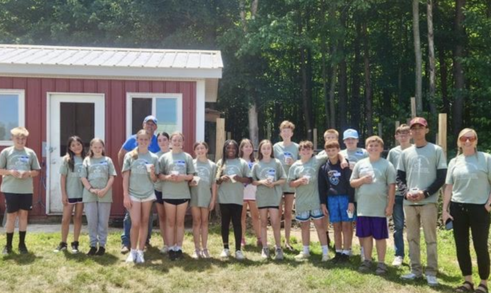 Students standing in front of a building