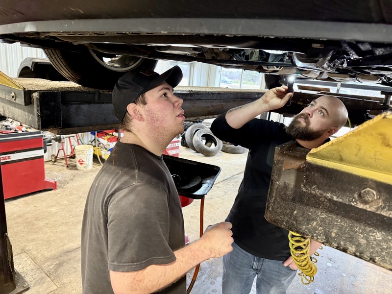 Student working on a vehicle 