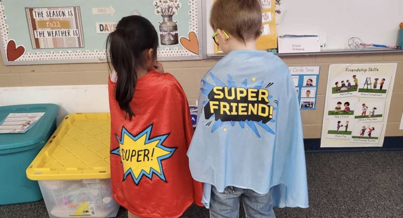 Students wearing capes