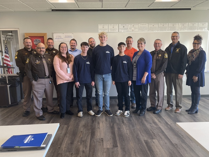 A group photo of the students, officers, and administration.