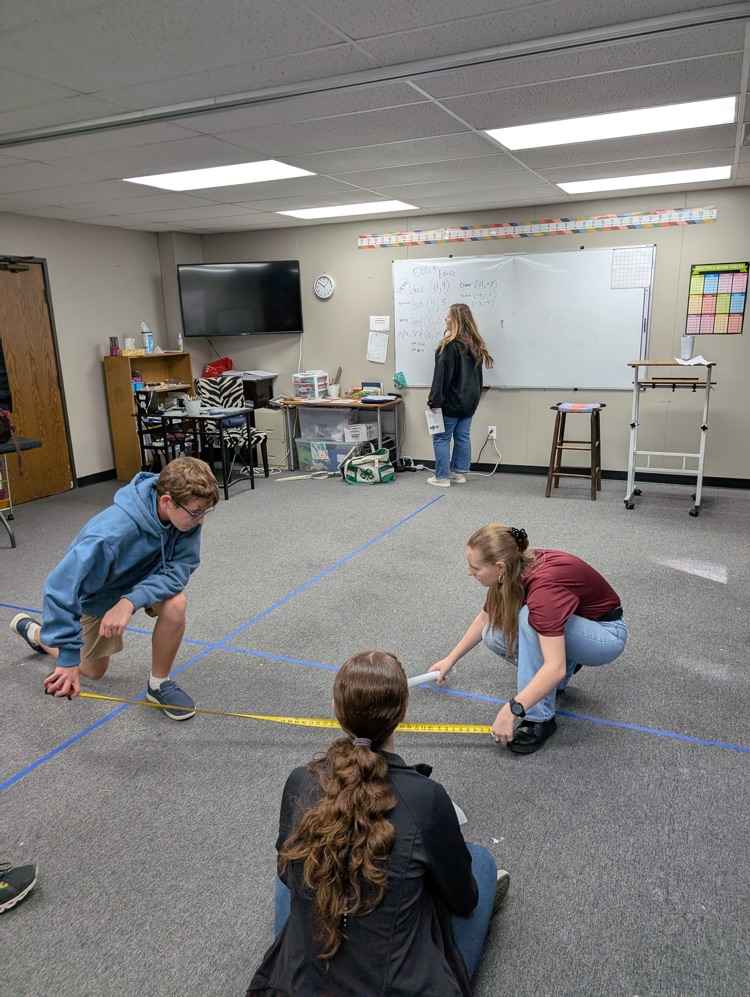 Geometry students doing some measuring